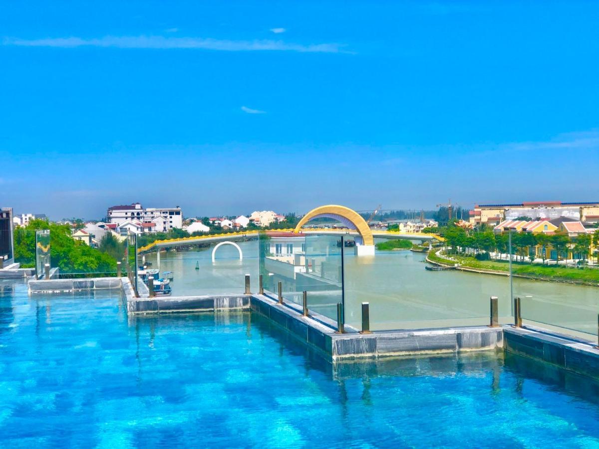 Little Riverside Hoi An . A Luxury Hotel & Spa Buitenkant foto View of the bridge from the rooftop pool of the hotel